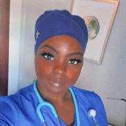 Santario Washington CRCP graduate in her nursing scrubs